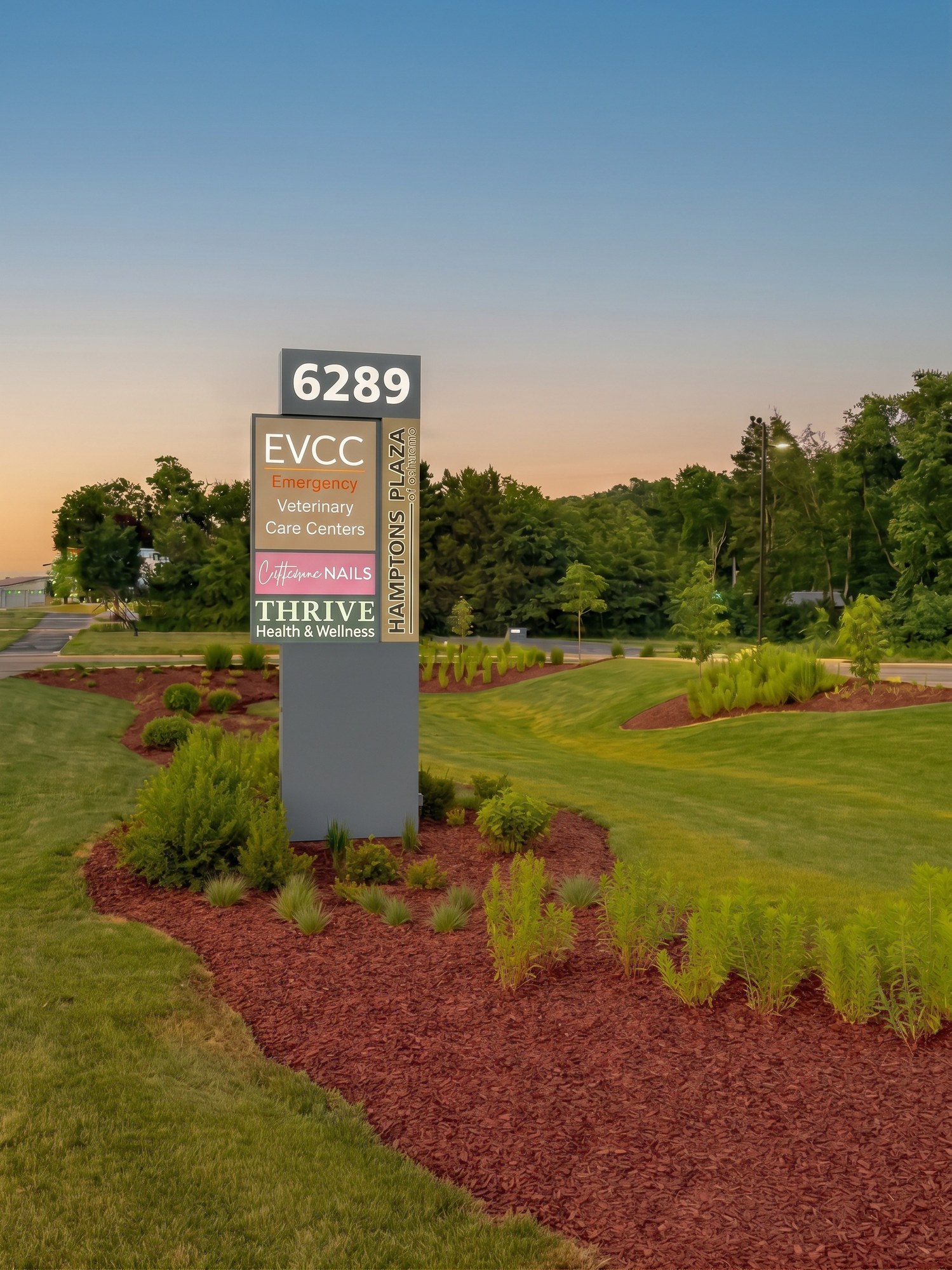 Hamptons Plaza of Oshtemo monument sign at dusk, 6289 West Main Street, Oshtemo Township, Kalamazoo, Michigan