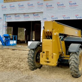 Carroll Development & Management construction site with lift equipment in West Michigan