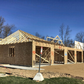New luxury apartment homes under construction with wood framing, attached garages and roof trusses, Carroll Development & Management, Battle Creek, MI